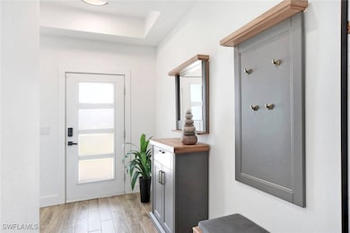 Doorway featuring light hardwood / wood-style floo