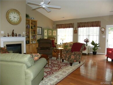 Great room with vaulted ceiling, hardwood floor, g