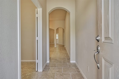 The entry to this home is quite spectacular! The archways combined with the soaring ceilings and the 18