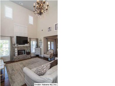 Gorgeous hanging chandelier located in the living 