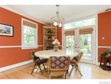 Bright Dining room with French doors leading to th