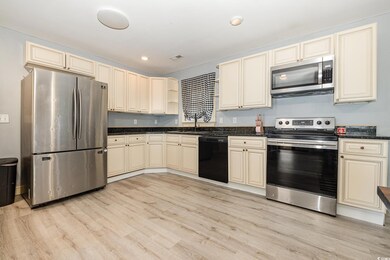 Kitchen featuring sink, light hardwood / wood-styl