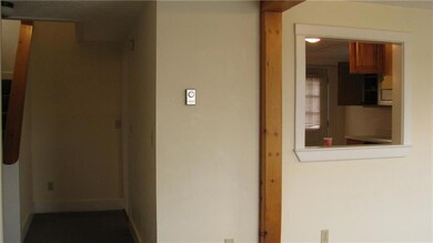 Looking from Living Room, Kitchen is...