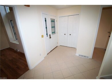 Large Foyer with closet and tile floor