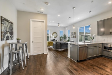 Kitchen featuring a peninsula, open floor plan, a