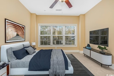 Bedroom with visible vents, carpet flooring, baseb