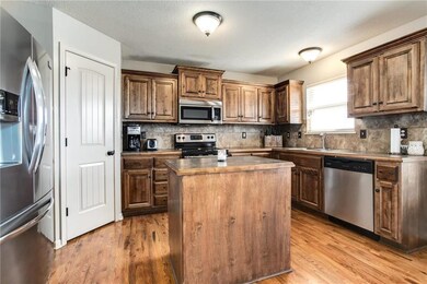 Walk in pantry, abundant cabinets and island are r