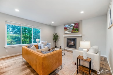 Open concept living room with gas fireplace and