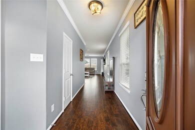 Front entrance of home leading into living room.