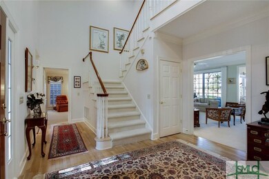 Views of foyer, living room and guest bedroom/den