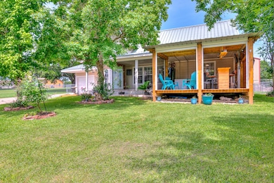 The inviting covered porch offers beautiful water