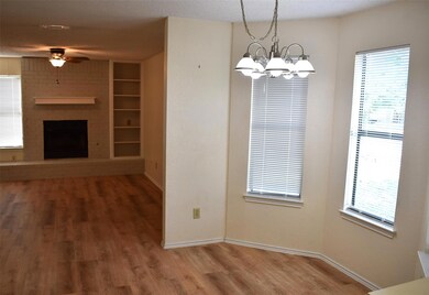 Unfurnished dining area featuring ceiling fan, wo