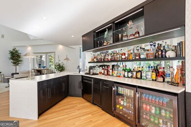 Bar includes two wine refrigerators, ice maker dishwasher, and tons of storage space
