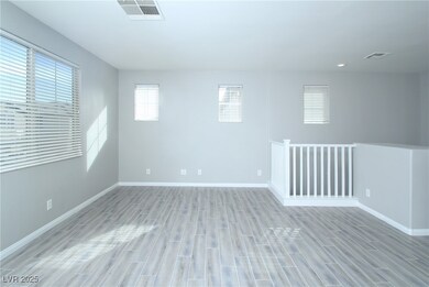 Empty room with wood finished floors, baseboards,