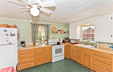Kitchen with view to cottage
