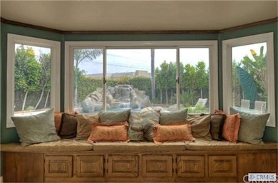 Pool view through kitchen bay window