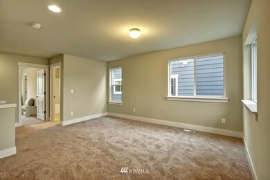 Loft space separates master suite from other bedrooms.  How would you use this space?