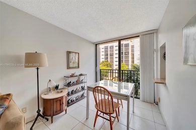 Dining area with floor to ceiling sliding glass door window