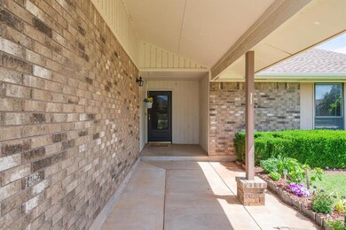 View of exterior entry featuring a patio area