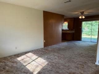 Kitchen featuring oven, sink, stainless steel gas cooktop, hanging light fixtures, and a textured ceiling