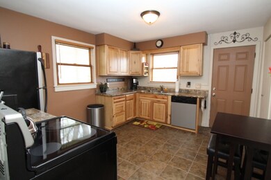 Another view of the kitchen showing the side door 
