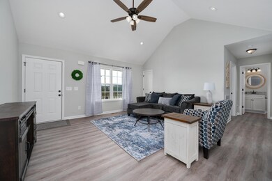 Spacious living area showcasing high ceilings, ceiling fan & neutral paint tones, making furnishing an absolute breeze! 603 Anna's Way Lewisburg, TN 37091