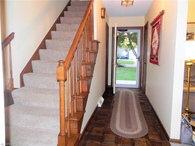 Foyer features inlaid wood floors.
