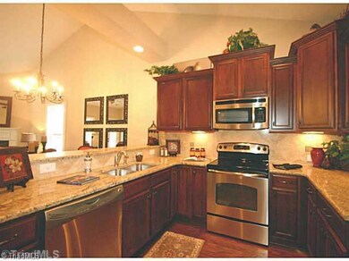 Kitchen. Well appointed kitchen with granite, tile backspash, stainless appliances, large pantry, bar height counter, and plenty of space for the gourmet in you!