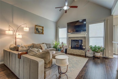 Focal Point of Living Room is Brick Fireplace with Mantle!
