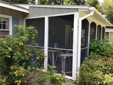 Exterior Front. Screened-in Porch