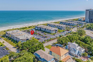 Aerial view with a beach view and a water view
