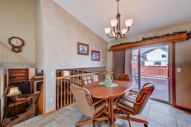 VAULTED DINING SPACE OPENS TO PRIVATE DECK AND FEN