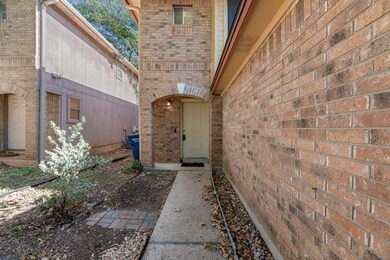 Property entrance featuring brick siding