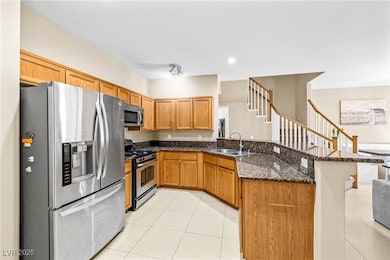 Kitchen with stainless steel appliances, a sink, a