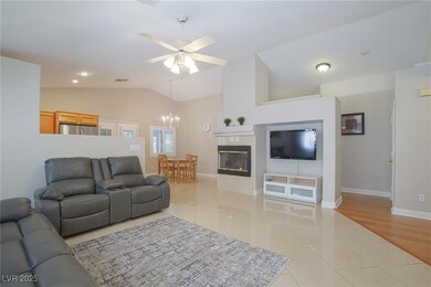 Living area with light tile patterned floors, loft