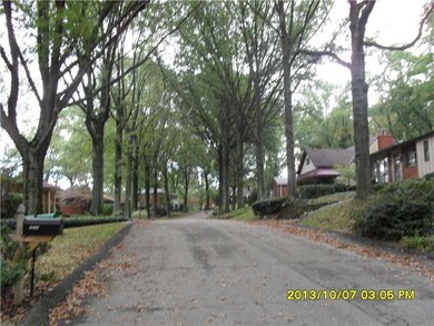 Exterior Front. Tree Lined Street