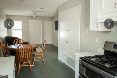Dining room featuring ceiling fan, concrete floor