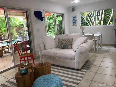 FAMILY AREA WITH SITTING AREA AND DINNING OVERLOOKING GARDEN AND POOL