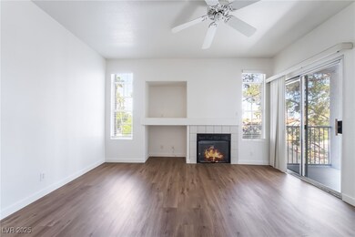 Unfurnished living room featuring wood finished fl
