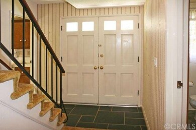 Double Door Entry to Tiled Foyer