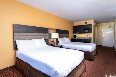 Bedroom featuring a textured ceiling and dark carp