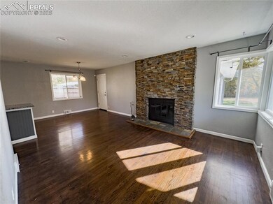 view of living room and dining area from front doo