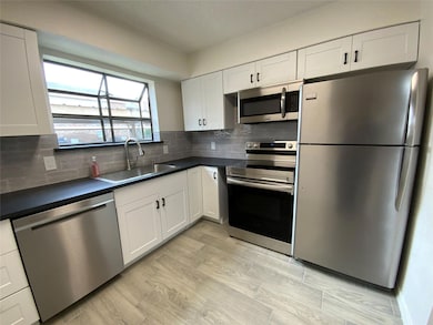 Kitchen featuring appliances with stainless steel 