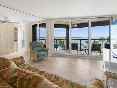 Living room featuring light tile patterned floors,