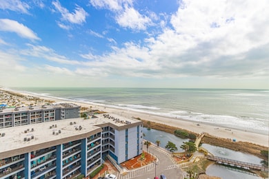 Drone / aerial view with a view of the beach and a water view