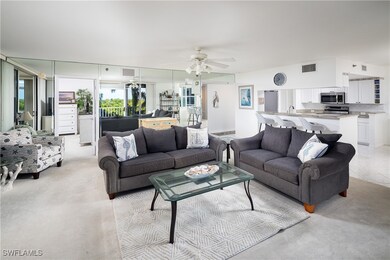 Living area with a ceiling fan and light colored c