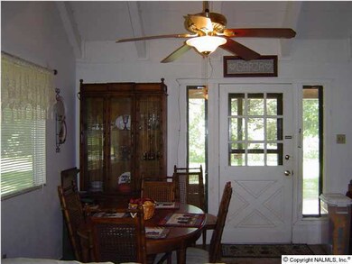 The dining room area is open to the greatroom and has a door that goes out to the covered backporch.