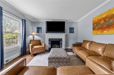 Living room with gas logs fireplace on the main floor.