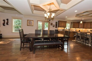 Large dining room featuring a coffered ceiling is 