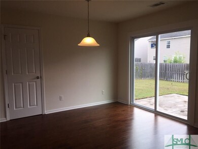 Dining Room With Sliding Glass Doors Leading to Ba